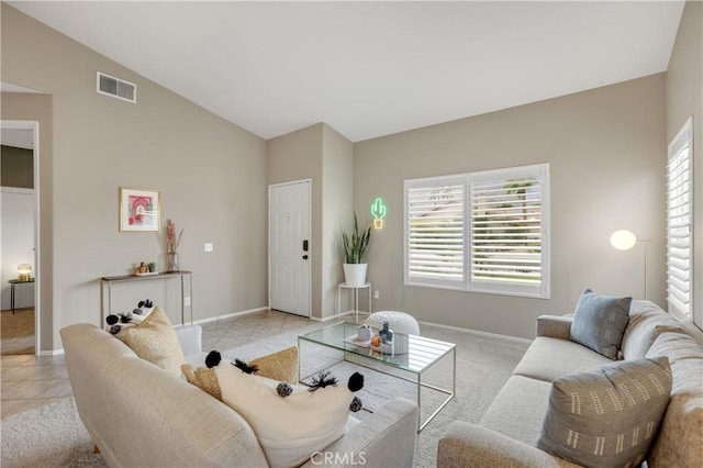 living room featuring baseboards, visible vents, and plenty of natural light
