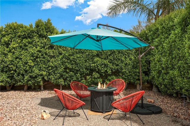 view of patio / terrace with an outdoor fire pit