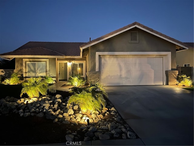 ranch-style home featuring a garage