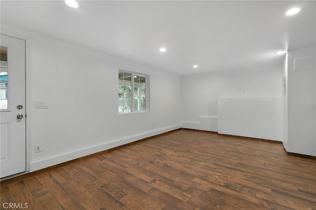 spare room with dark hardwood / wood-style floors