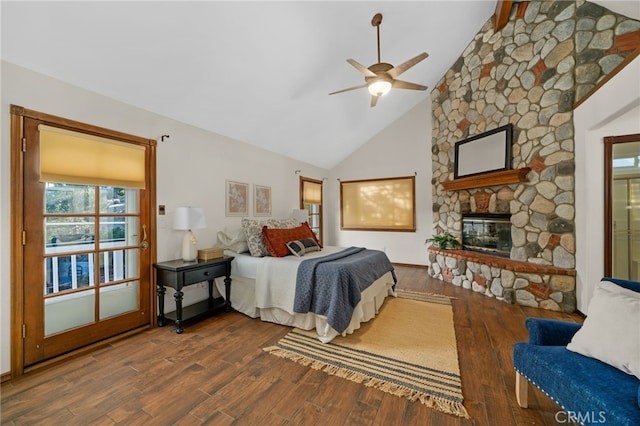 bedroom with dark wood-type flooring, high vaulted ceiling, a stone fireplace, ceiling fan, and beam ceiling