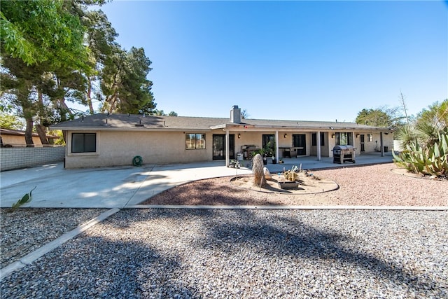 back of property featuring a patio area