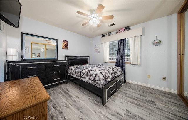 bedroom featuring ceiling fan and light hardwood / wood-style floors