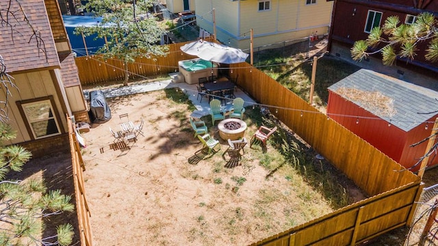 view of yard with a patio and an outdoor fire pit