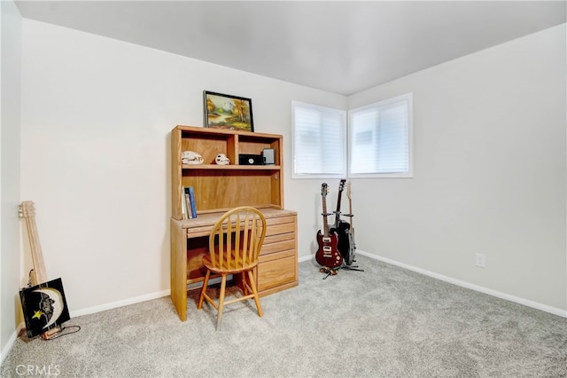 carpeted office featuring built in desk