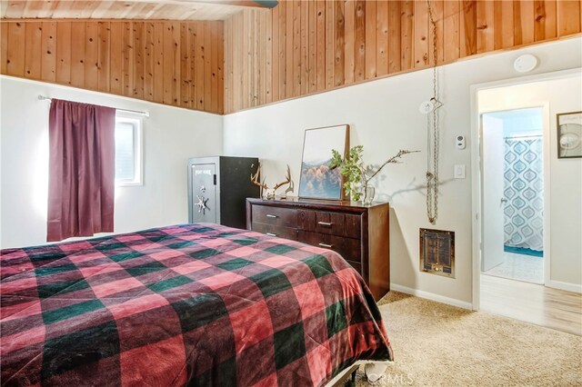 carpeted bedroom featuring wood ceiling, heating unit, high vaulted ceiling, wood walls, and beamed ceiling