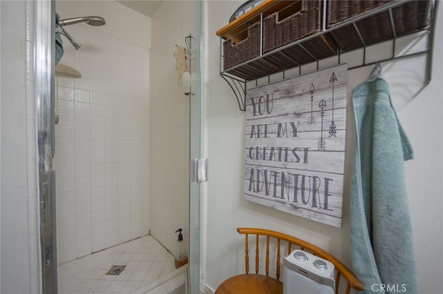 bathroom featuring a shower with door