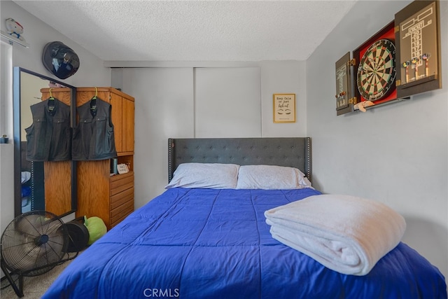 bedroom featuring a textured ceiling