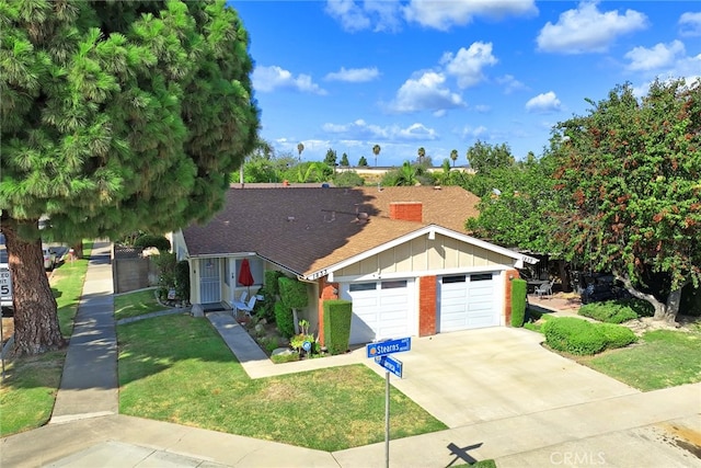 view of front facade with a front yard and a garage