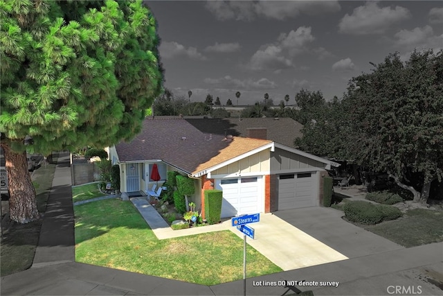 view of front of home featuring a garage and a front yard