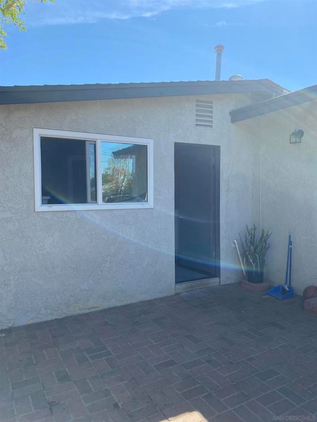 view of home's exterior featuring a patio area