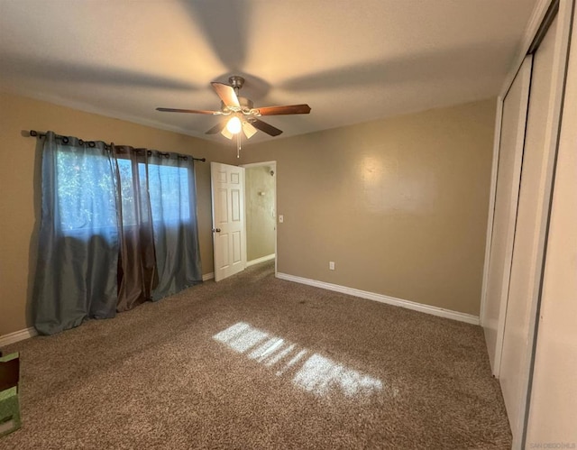 unfurnished bedroom featuring carpet floors and ceiling fan