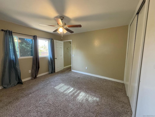 unfurnished bedroom featuring carpet floors, a closet, and ceiling fan