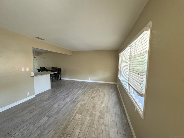 unfurnished living room with hardwood / wood-style floors