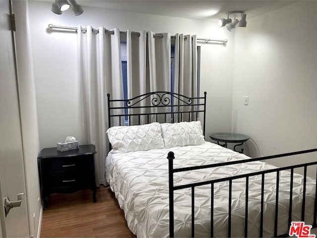 bedroom featuring hardwood / wood-style flooring