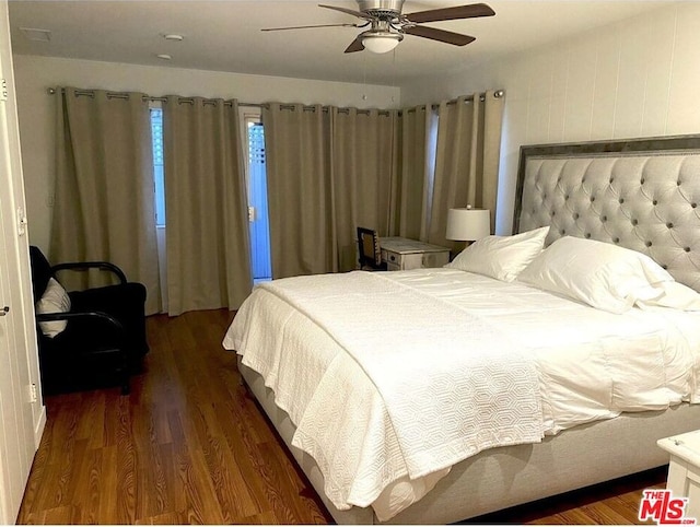 bedroom featuring ceiling fan and dark hardwood / wood-style floors