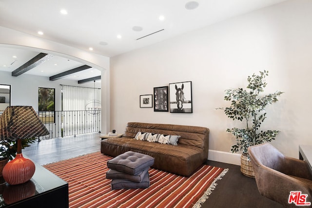 living room with beam ceiling and hardwood / wood-style flooring