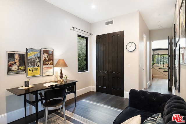 entrance foyer with dark hardwood / wood-style floors