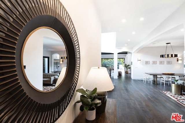 hallway with dark hardwood / wood-style flooring