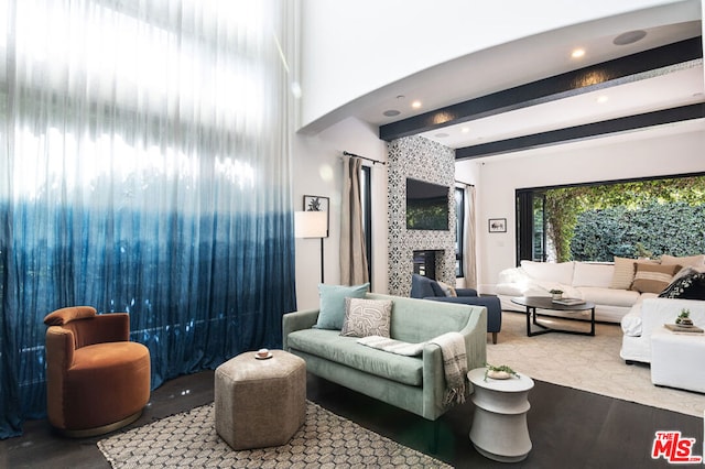 interior space with a fireplace and beam ceiling