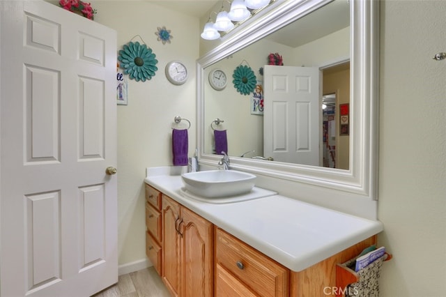 bathroom with vanity and hardwood / wood-style flooring