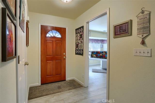 entryway with light hardwood / wood-style flooring