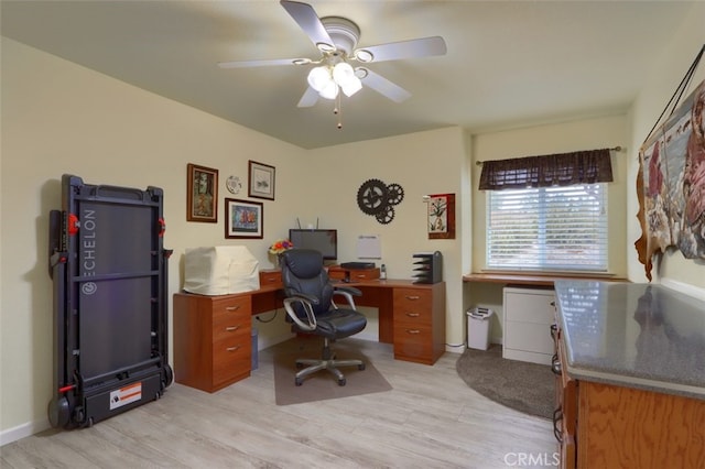 home office featuring ceiling fan and light hardwood / wood-style floors