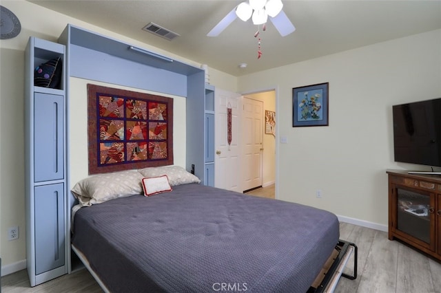 bedroom featuring ceiling fan and light hardwood / wood-style flooring