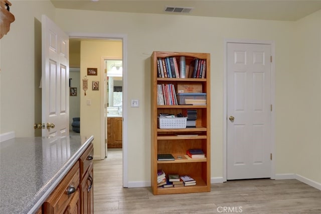 hallway featuring light hardwood / wood-style floors