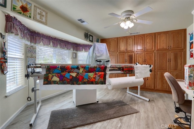 dining room with ceiling fan, light hardwood / wood-style floors, and a wealth of natural light