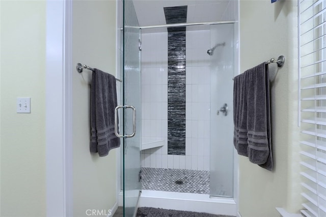 bathroom featuring an enclosed shower