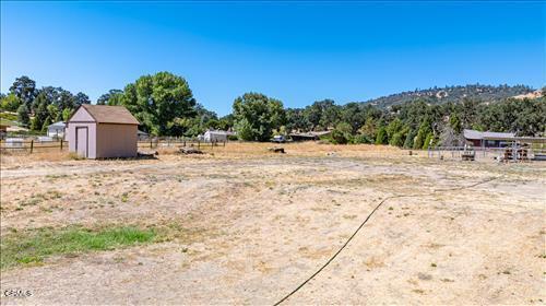 view of yard featuring a storage unit and a rural view