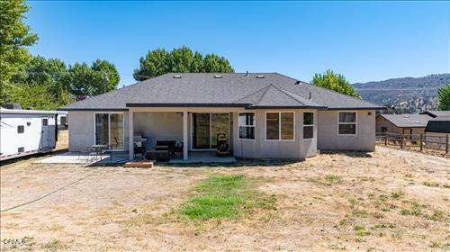 rear view of property featuring a patio area