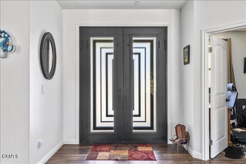 entryway featuring french doors and dark hardwood / wood-style flooring