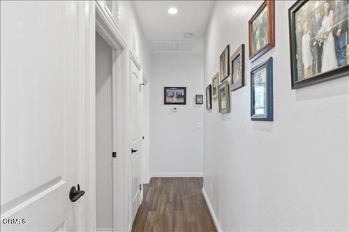 hallway featuring dark wood-type flooring