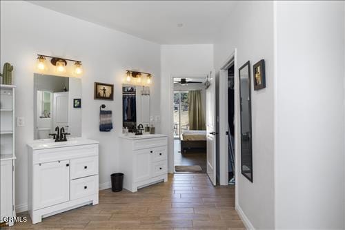 bathroom featuring vanity, ceiling fan, and hardwood / wood-style flooring