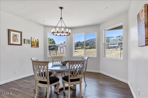 dining room featuring dark hardwood / wood-style flooring and a chandelier