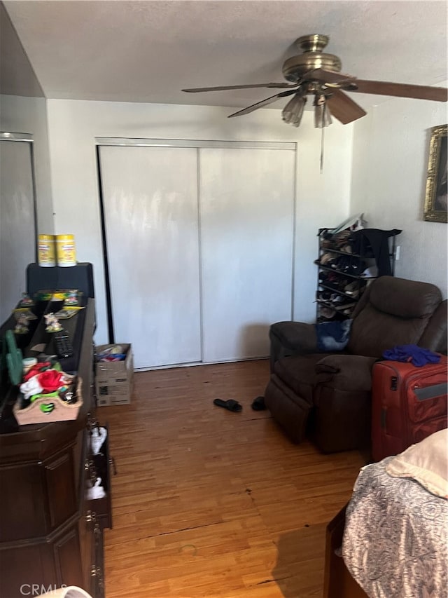 bedroom featuring ceiling fan and hardwood / wood-style floors