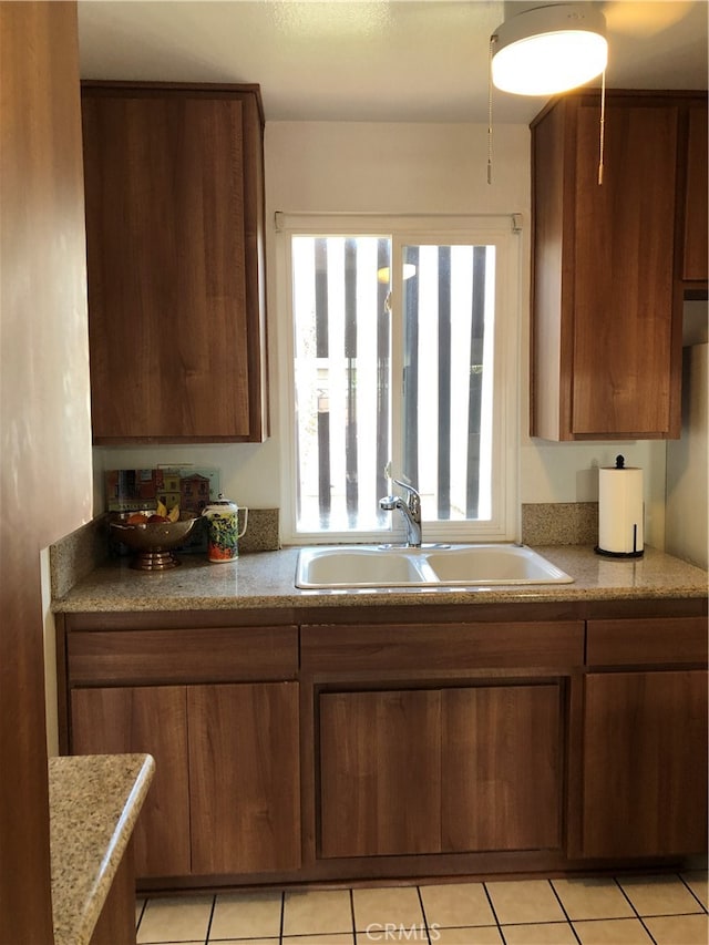 kitchen with sink and light tile patterned floors