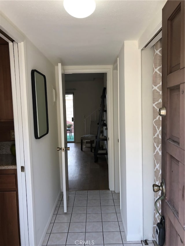 hallway with light tile patterned flooring