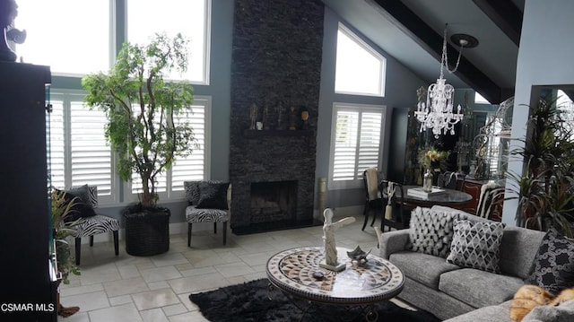 living room featuring a chandelier, beam ceiling, high vaulted ceiling, and a fireplace