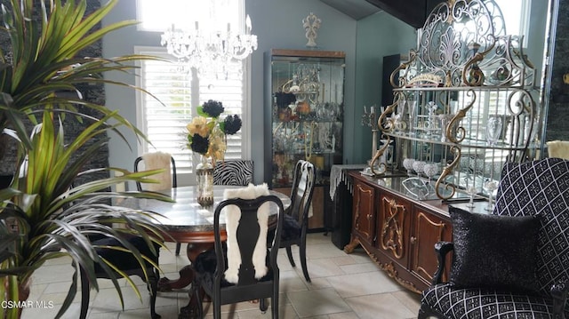 dining space with an inviting chandelier