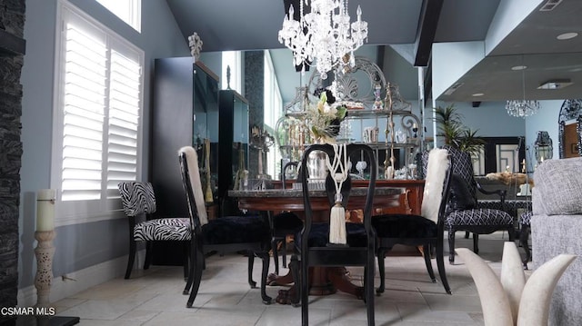 dining area featuring a chandelier and a healthy amount of sunlight