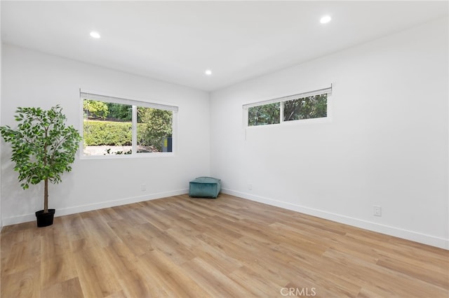 unfurnished room featuring light hardwood / wood-style floors