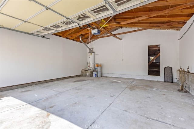 garage with secured water heater and a garage door opener