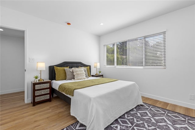 bedroom with wood-type flooring