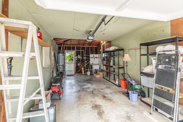 garage featuring gas water heater and a garage door opener