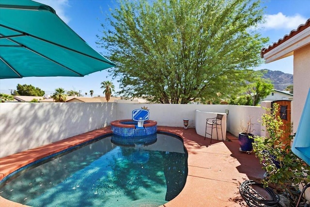 view of swimming pool with a mountain view