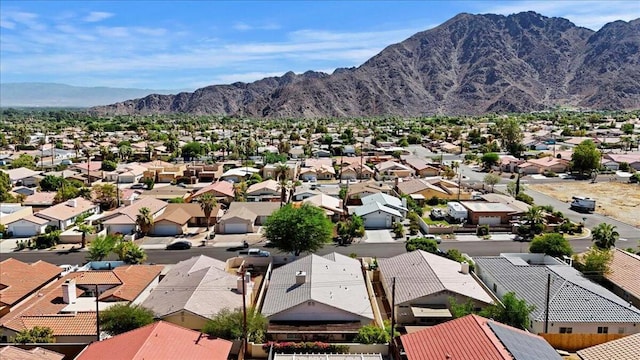 birds eye view of property with a mountain view