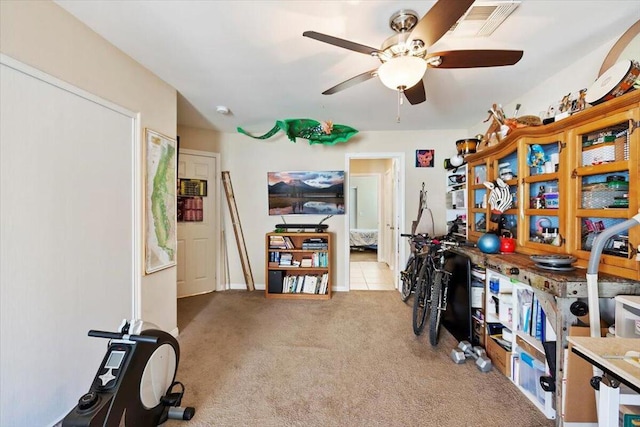 interior space with light colored carpet and ceiling fan